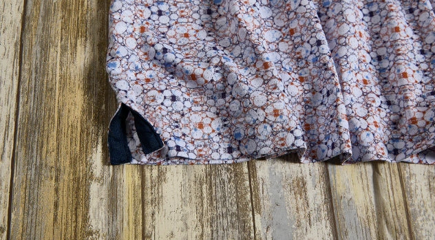 Nicoby Short Sleeve Performance Print Polo in Navy and Orange